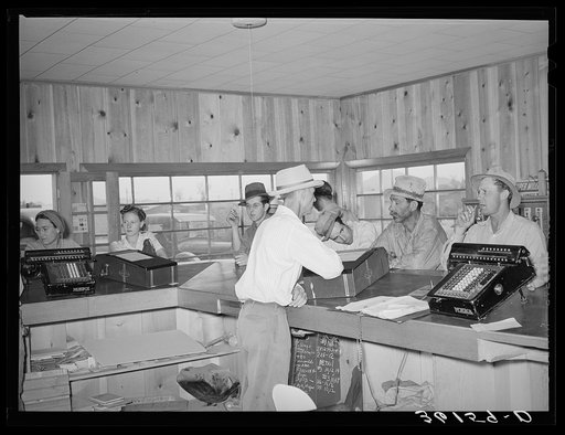 Members of the United Producers and Consumers Cooperative waiting to be served at the lumberyard office. Phoenix, Arizona