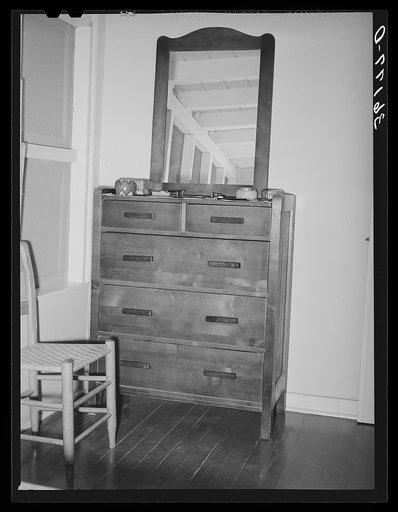 Dresser in bedroom of an apartment at the Arizona part-time farms. Maricopa County, Arizona. The furniture in the apartment on this project was designed especially for them