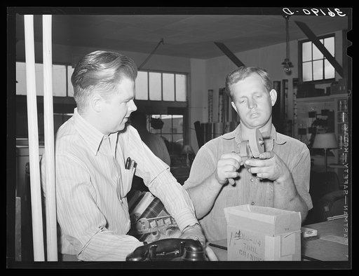 Member of the United Producers and Consumers Cooperative buying a small tool grinder. Phoenix, Arizona