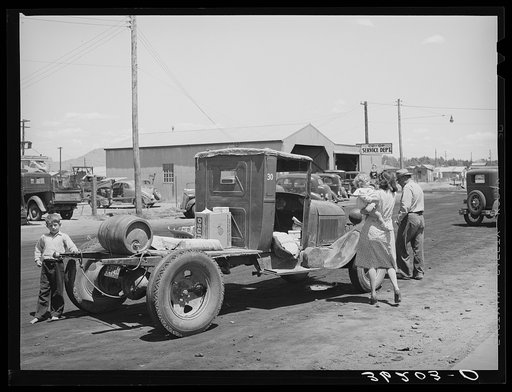 Farmer with his truck loaded with goods which he has bought from the United Producers and Consumers Cooperative. Phoenix, Arizona