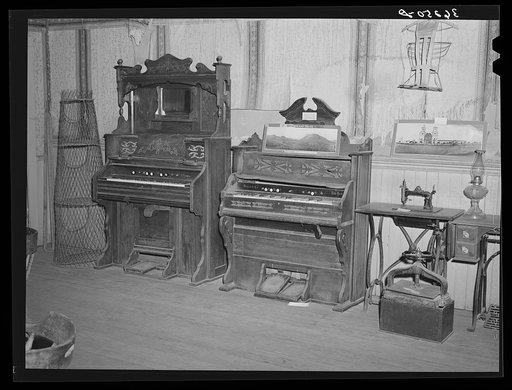 Organs and other relics on display at the Bird Cage Theater museum. Tombstone, Arizona. The Bird Cage Theater boasted such performers as Lilly Langtry and Anna Held. Seats on the main floor were ten dollars, in the boxes thirty dollars. Whiskey, beer and champagne was served to the audience during t