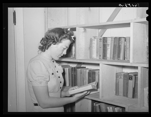 Librarian of the small lending library at the Casa Grande Valley Farms. Pinal County, Arizona