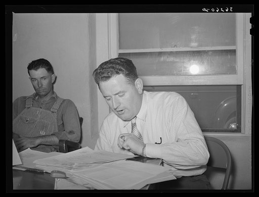 FSA (Farm Security Administration) official reporting expenditures of the Casa Grande Valley Farms, Pinal County, Arizona, at a board meeting