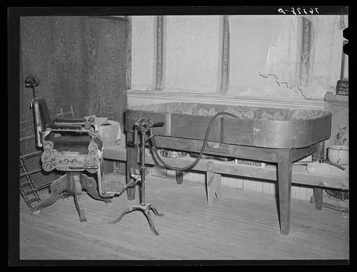 Old dice table and barber chair on display at the Bird Cage Theater museum. Tombstone, Arizona