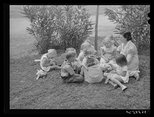 WPA (Work Projects Administration) nursery school supervisor with her young charges at the Casa Grande Valley Farms. Pinal County, Arizona