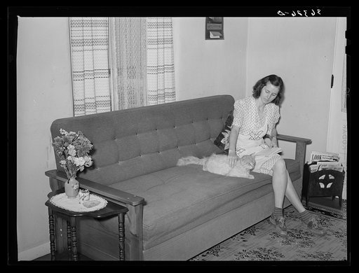 Wife of member of Casa Grande Valley Farms in corner of their living room. Pinal County, Arizona