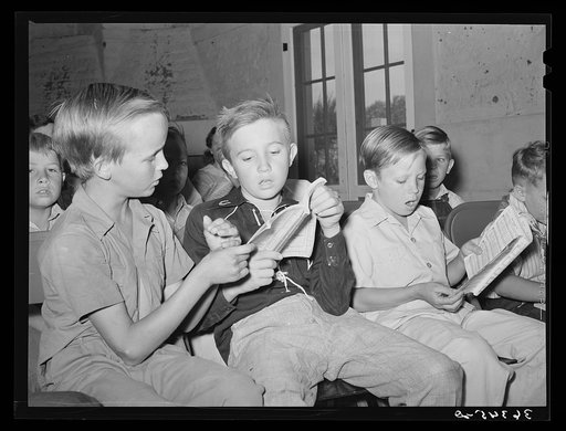 Young boys singing at Sunday school at the community house at the Casa Grande Valley Farms. Pinal County, Arizona
