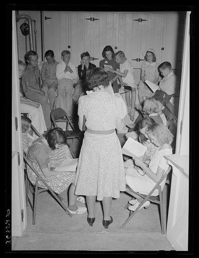 Sunday school lesson at the community house of the Casa Grande Valley Farms. Pinal County, Arizona