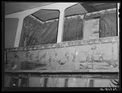 Detail of Bird Cage Theater, now a museum, at Tombstone, Arizona. The boxes are shown above. The decorations are colored lithographs used as circus posters in the 1880s
