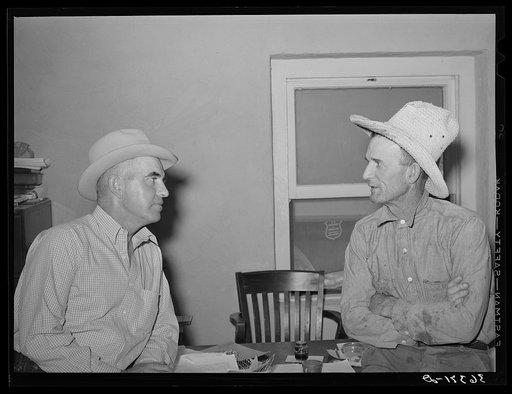 Casa Grande Valley Farms' manager on left talking with a member of the cooperative. Pinal County, Arizona