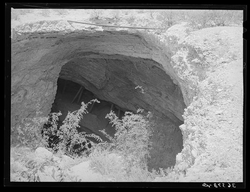 Untitled photo, possibly related to: The Million Dollar Stope from which a million dollars worth of silver was taken in Tombstone's initial boom. Stope mining is carried on in timber- supported passages. The passages lead for miles under the surrounding county and connect with other mines. Tombstone