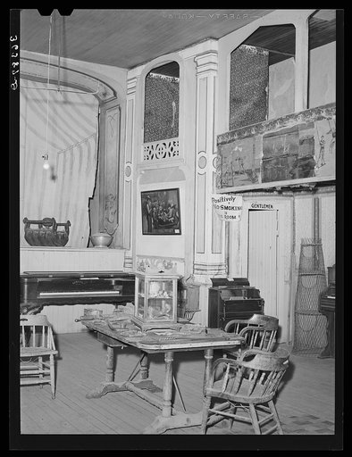 Corner of the Bird Cage Theater, now a museum. Notice boxes at the side. These were expensive and popular during the early days of the town. Tombstone, Arizona
