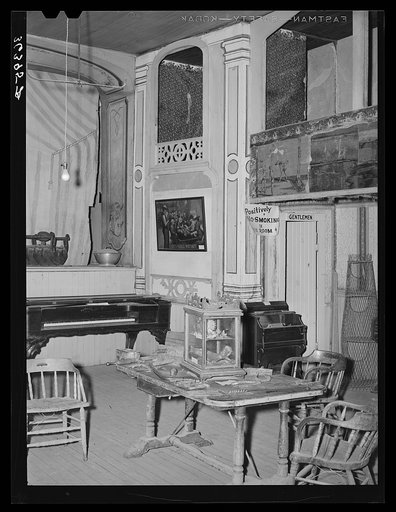 Untitled photo, possibly related to: Corner of the Bird Cage Theater, now a museum. Notice boxes at the side. These were expensive and popular during the early days of the town. Tombstone, Arizona