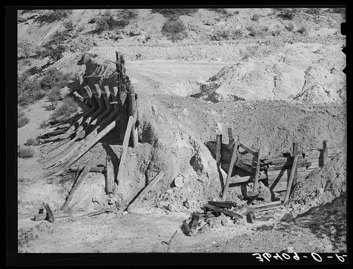 Remains of timber support and tailings of abandoned copper mine at Leopold, New Mexico