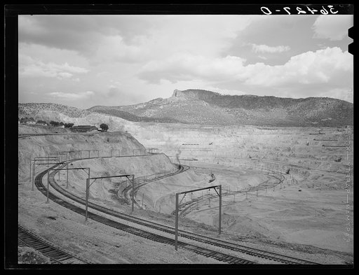 Largest open pit copper mine in the world at Santa Rita, New Mexico. Copper was discovered here by an officer of the Spanish army in 1800 who sold the same to a wealthy Spanish merchant. Pure native copper was transported by pack mule to Mexico City to enter the royal mint for coinage. In 1900 a you