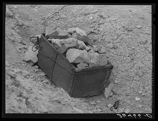 Untitled photo, possibly related to: Old ore bucket and gold ore at abandoned gold mine at Pinos Altos, New Mexico