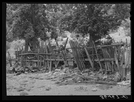 Fence made of wood and automobile parts at Georgetown, New Mexico