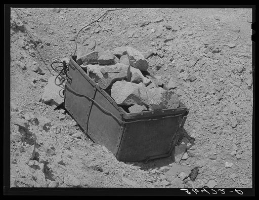 Old ore bucket and gold ore at abandoned gold mine at Pinos Altos, New Mexico