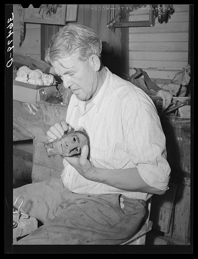 Homer Tate working on a papier mache head. Safford, Arizona