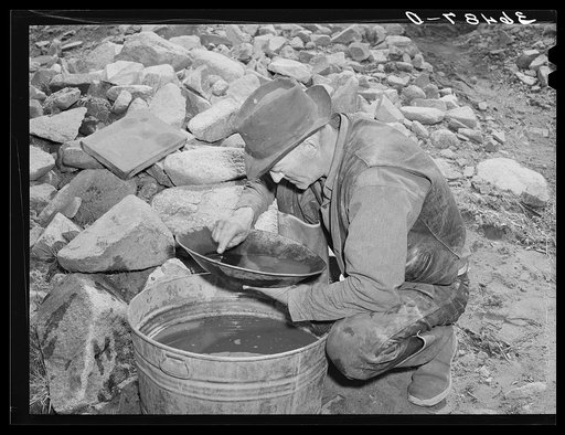 Eugene Davis panning gold. Pinos Altos, New Mexico