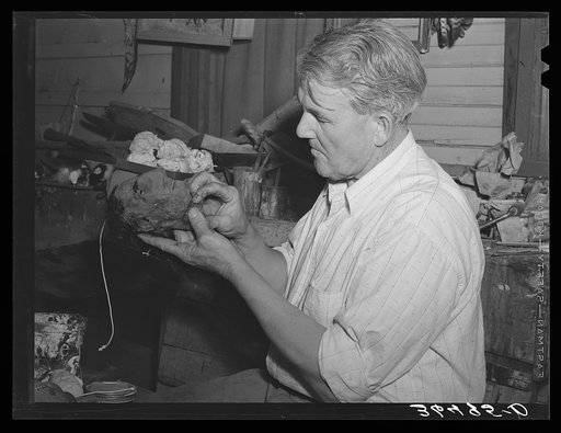 Homer Tate making a papier mache head. Safford, Arizona
