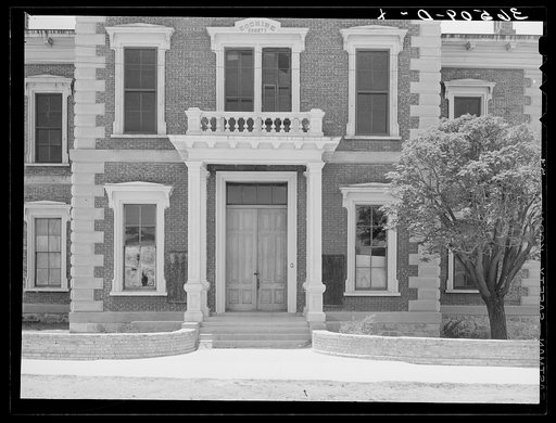 Front of abandoned courthouse at Tombstone, Arizona. Tombstone was the county seat of Cochise County until 1931 when the county offices were moved to Bisbee