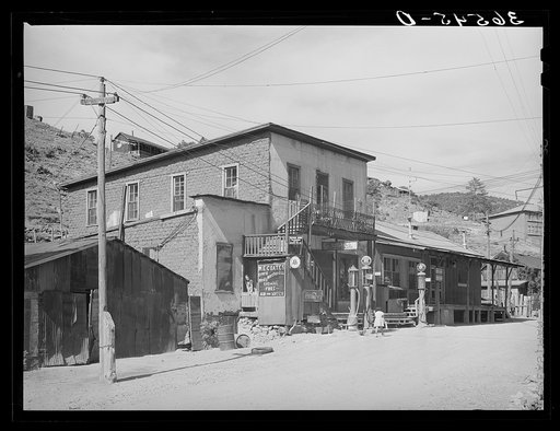 Store and gasoline pumps on main street of Mogollon, New Mexico. Second largest gold mine in the state. The inhabitants of the town are about evenly divided as to Spanish and Anglo-American