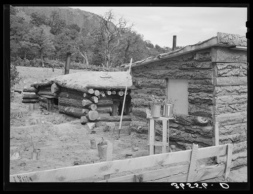 Side of house of Jack Whinery, farmer at Pie Town, New Mexico. Whinery came to Pie Town last fall from Texas where he had been a farm day laborer. The dugout was built first, small room in foreground added later. It is characteristic of these people that they retain their dugouts as they add to thei