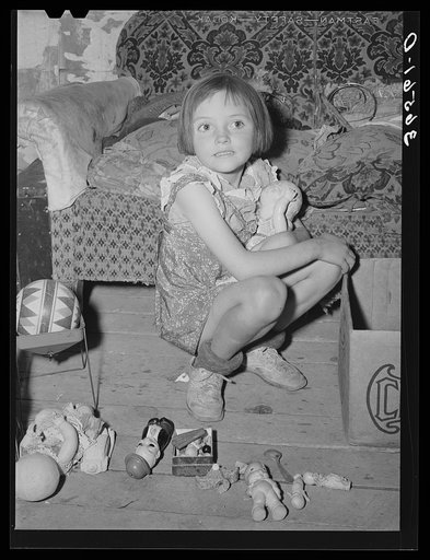 Josie Caudill with her toys. Pie Town, New Mexico