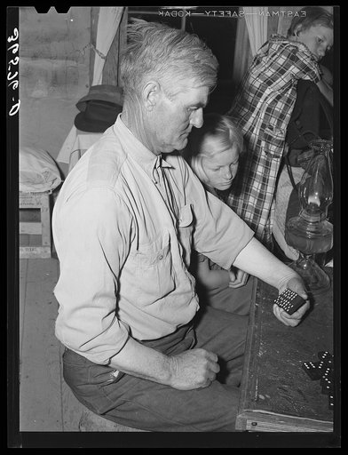 Mr. Besson, formerly an Oklahoma tenant farmer, playing Forty-two at party after literary society. Pie Town, New Mexico