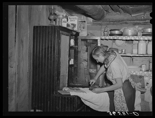 Mrs. Faro Caudill ironing. Pie Town, New Mexico. Mrs. Caudill was born and finished high school at Sweetwater, Texas, before coming with her husband to Pie Town, New Mexico, to homestead