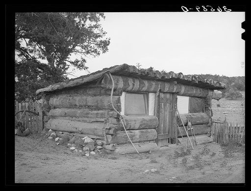 Original log home of homesteader. They have this year built an adobe house. Pie Town, New Mexico