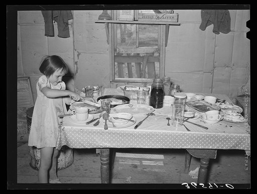 Josie Caudill cutting pie at neighbor's house where several families are visiting to celebrate a birthday. Pie Town, New Mexico
