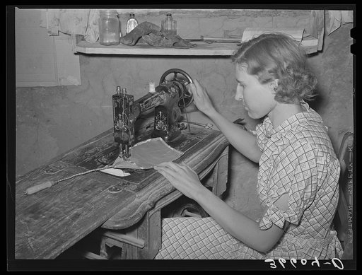 Mrs. Jack Whinery making a fly swatter. These homesteaders never buy anything that they can make at home. Pie Town, New Mexico
