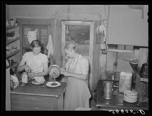 Mother and daughter working in the cafe kitchen. The daughter with her husband run the cafe. Pie Town, New Mexico