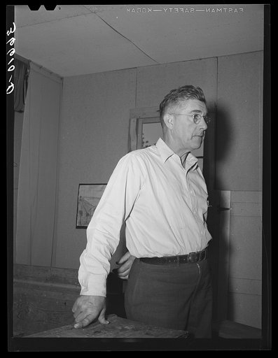 Mr. Keele, merchant and president of the Farm Bureau. Pie Town, New Mexico. Mr. Keele was a merchant in West Texas, went broke during the dust storm years, and came to Pie Town and went into partnership with Mr. Craig in the general store