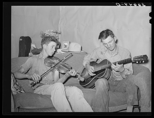 Farmer and his brother making music. Pie Town, New Mexico