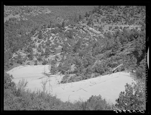 Untitled photo, possibly related to: Mill and office buildings with tailings in foreground. Mogollon, New Mexico