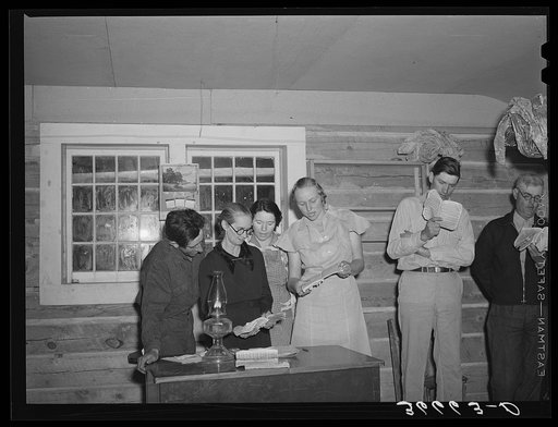 Farmers and wives singing at the literary society. Pie Town, New Mexico