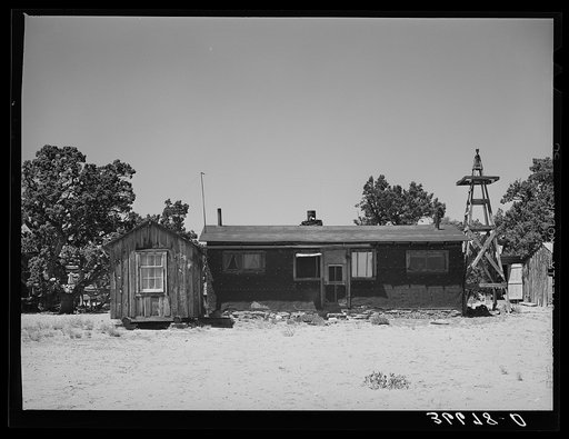 Home of the George Huttons, homesteaders, from Maud, Oklahoma. The small building on the left side is the one in which young Hutton homesteaded. He now lives with his mother and father and they farm the two farms together. Pie Town, New Mexico