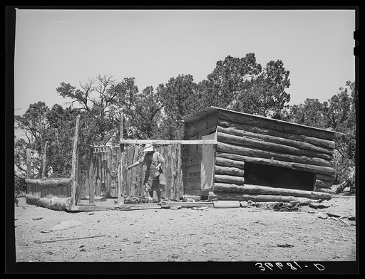 Mrs. George Hutton feeding her chickens. Pie Town, New Mexico. Practically every farmer raises chickens both for home consumption and the market. When eggs are bringing poor price, Mrs. Hutton preserves hers for home consumption and then when the price goes up, she sells all eggs her chickens lay us