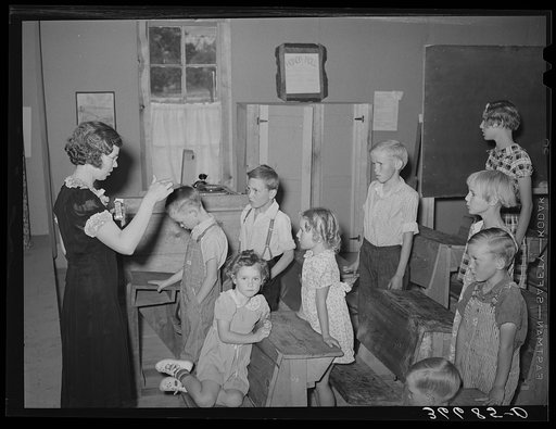 Untitled photo, possibly related to: The school day opens with prayer at private school at the Farm Bureau building. Pie Town, New Mexico