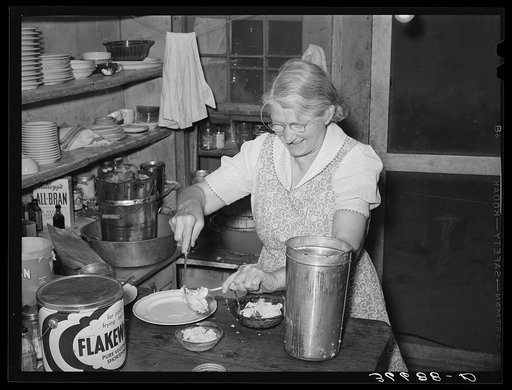 Mrs. Holley, Sr., dishing up ice cream. Pie Town, New Mexico