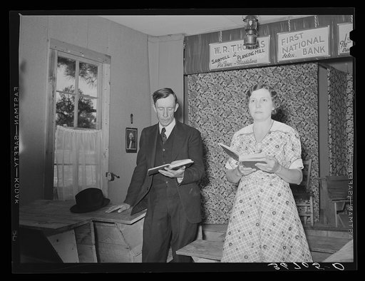 Farmer and his wife leading the singing at Sunday school. Pie Town, New Mexico