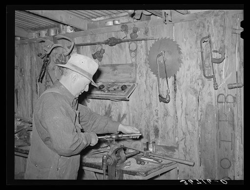 George Hutton Sr., in the machine shop on his farm. Pie Town, New Mexico