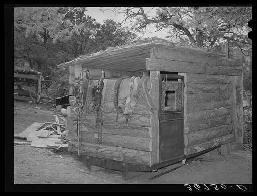 Shed made of slabs and parts of an old automobile. Pie Town, New Mexico