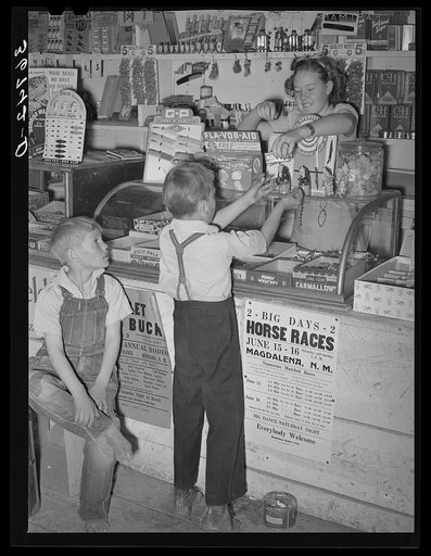 Farm children buying candy at the general store at Pie Town, New Mexico