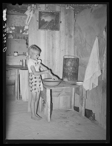 Jack Whinery's daughter washing her hands before dinner. Pie Town, New Mexico