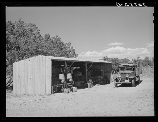 Untitled photo, possibly related to: Toolshed on farm of George Hutton. Notice the homemade bean thresher at the right. Pie Town, New Mexico
