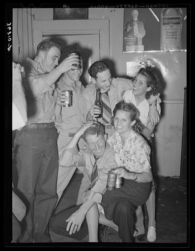"Cutting up" at the bar on payday. Mogollon, New Mexico
